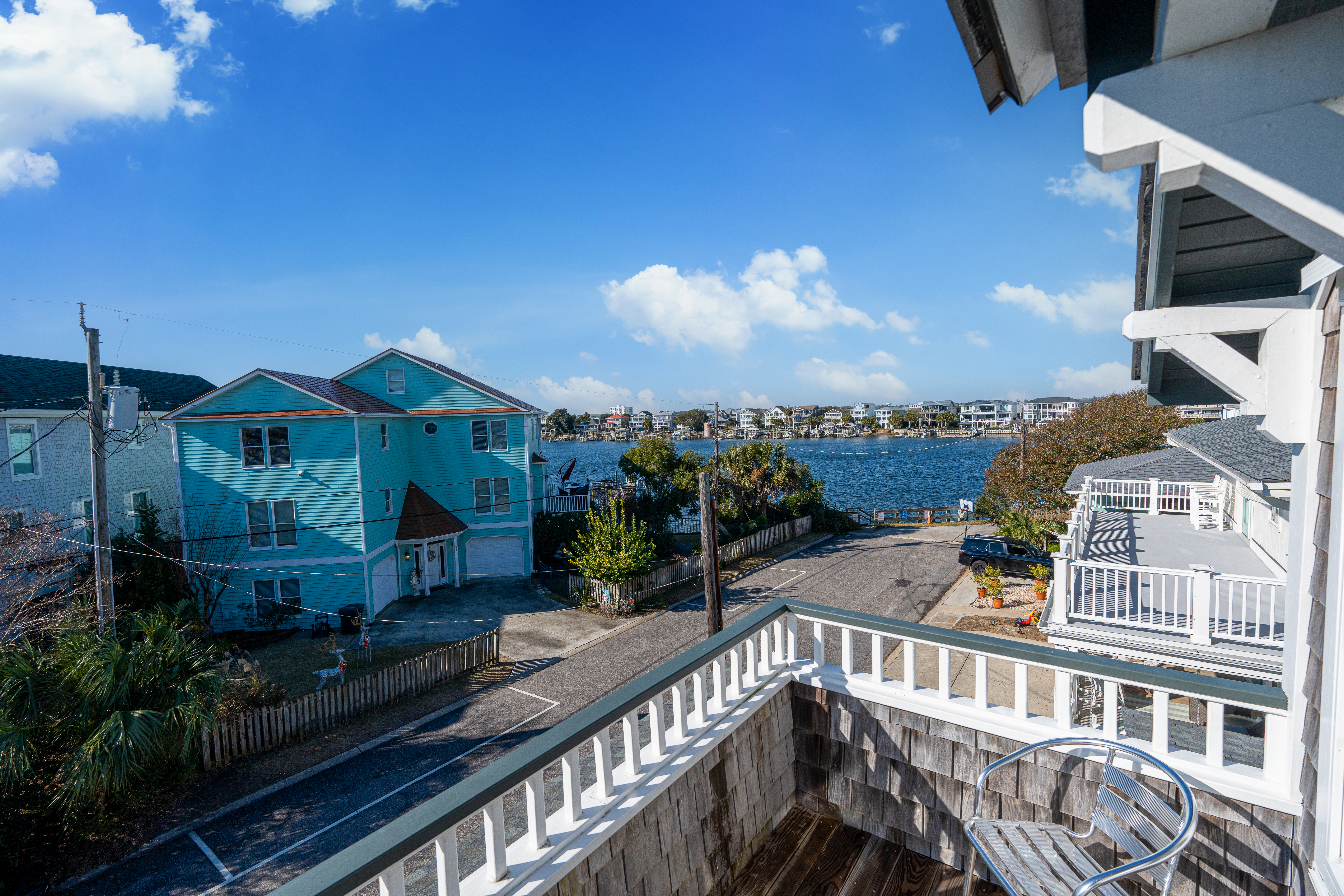 The view from an upper porch across the street toward the water